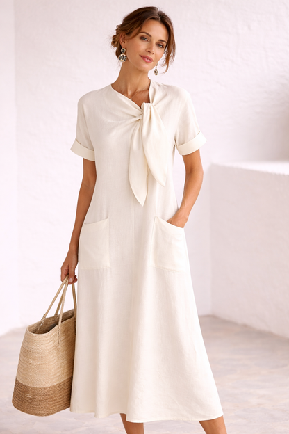 Fleur | Vestido elegante con lazo y bolsillos.